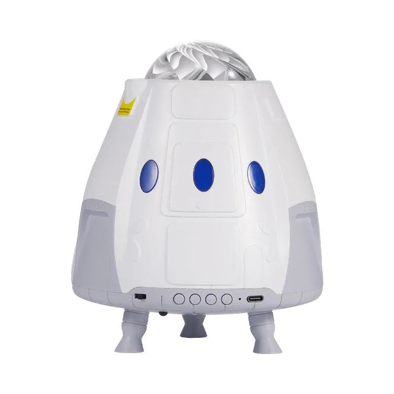Space capsule shaped USB projection lamp showing galaxy light effect on a wall