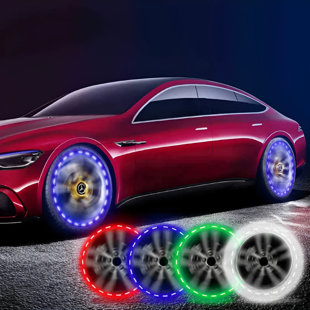 Colourful solar-powered LED valve light attached to a vehicle wheel hub.