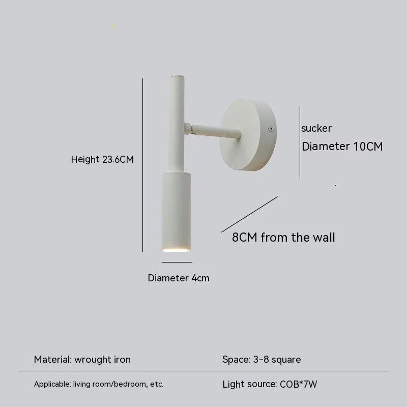 Black and white modern wrought iron wall lamp with a compact shade.