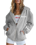 A black loose-fit zipper hooded sweater coat on a hanger, showing the full front zipper and hood.
