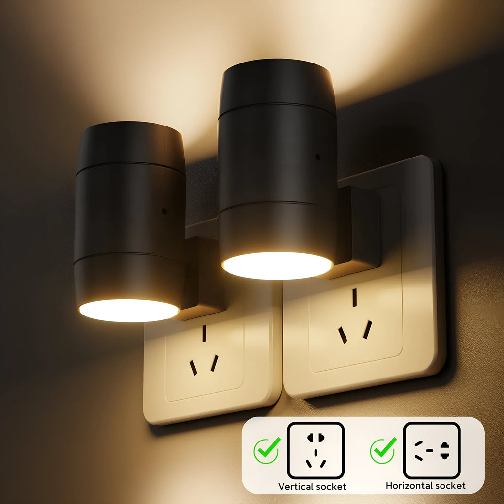 Small white plug-in night lamp with adjustable dial and rotatable light head on a grey background.