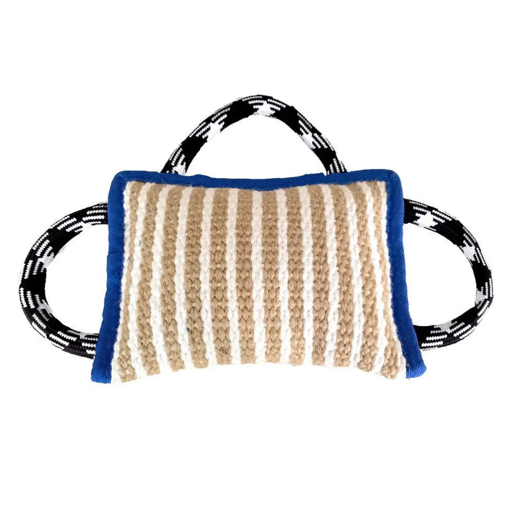 Dog tug of war toy with blue jute bite pillow and three rope handles on a wooden floor.