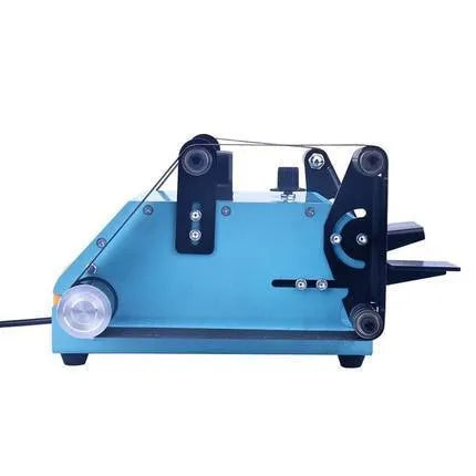 Blue desktop dual-axis belt sander with two sanding heads and a variable speed switch, shown on a workshop bench.