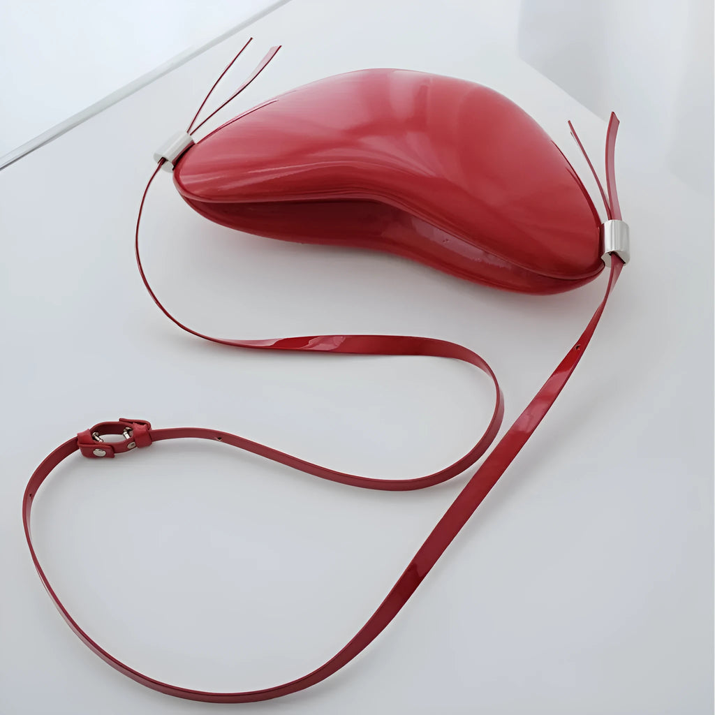 Red PU heart crossbody bag with single shoulder strap and sandwich pocket