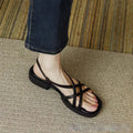 Women's cross strap buckle sandals with square toe, open toe, flat rubber sole, in milky white, black, or brown