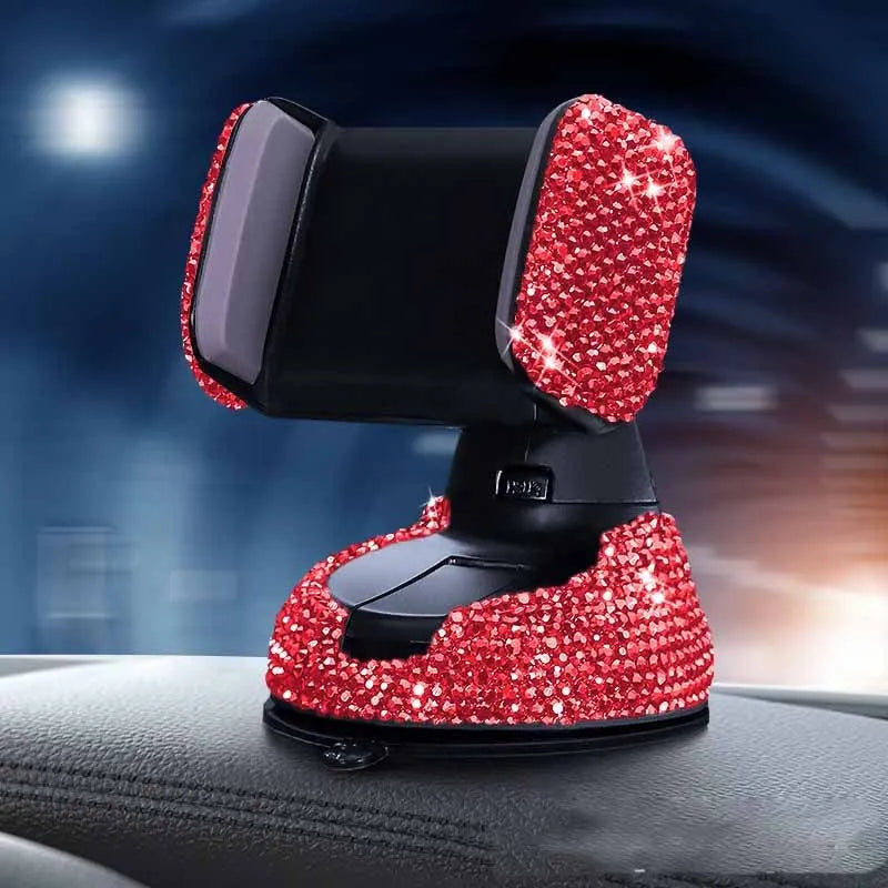 Diamond-encrusted car phone holder mounted on air vent with adjustable push-button mechanism and smartphone securely held