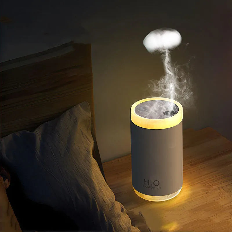 White USB jellyfish humidifier with night light on a wooden desk