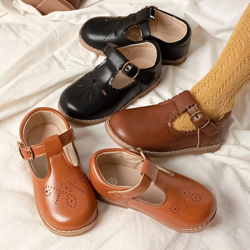 Girls British style PU leather shoes with hollow breathable upper and Velcro fastening, available in black