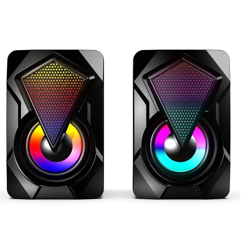 X2 RGB USB desktop multimedia speaker pair with extra bass, wired connection, and colourful lighting on a desk