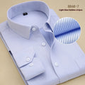 Men's black slim fit long sleeve business shirt made of cotton on a hanger.