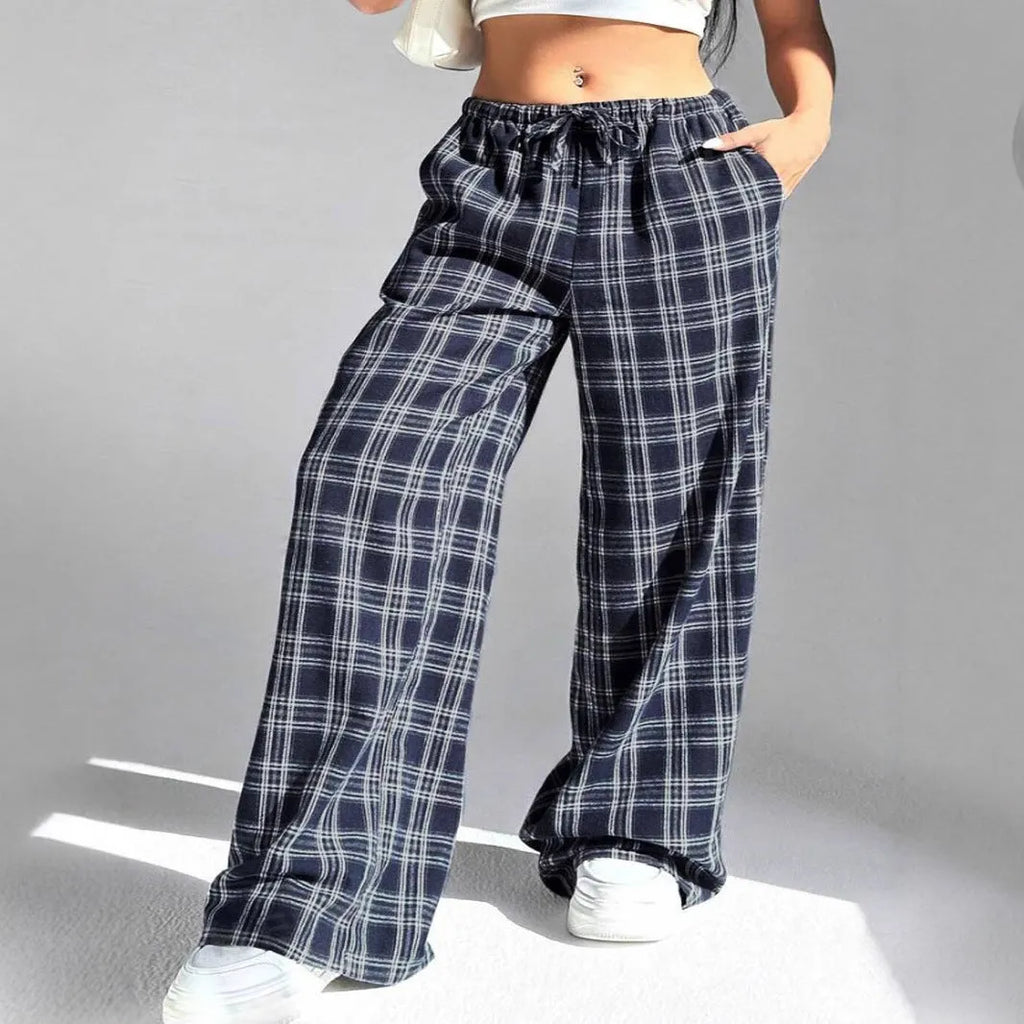 Women's red and blue plaid casual trousers with a drawstring waist and side pockets.
