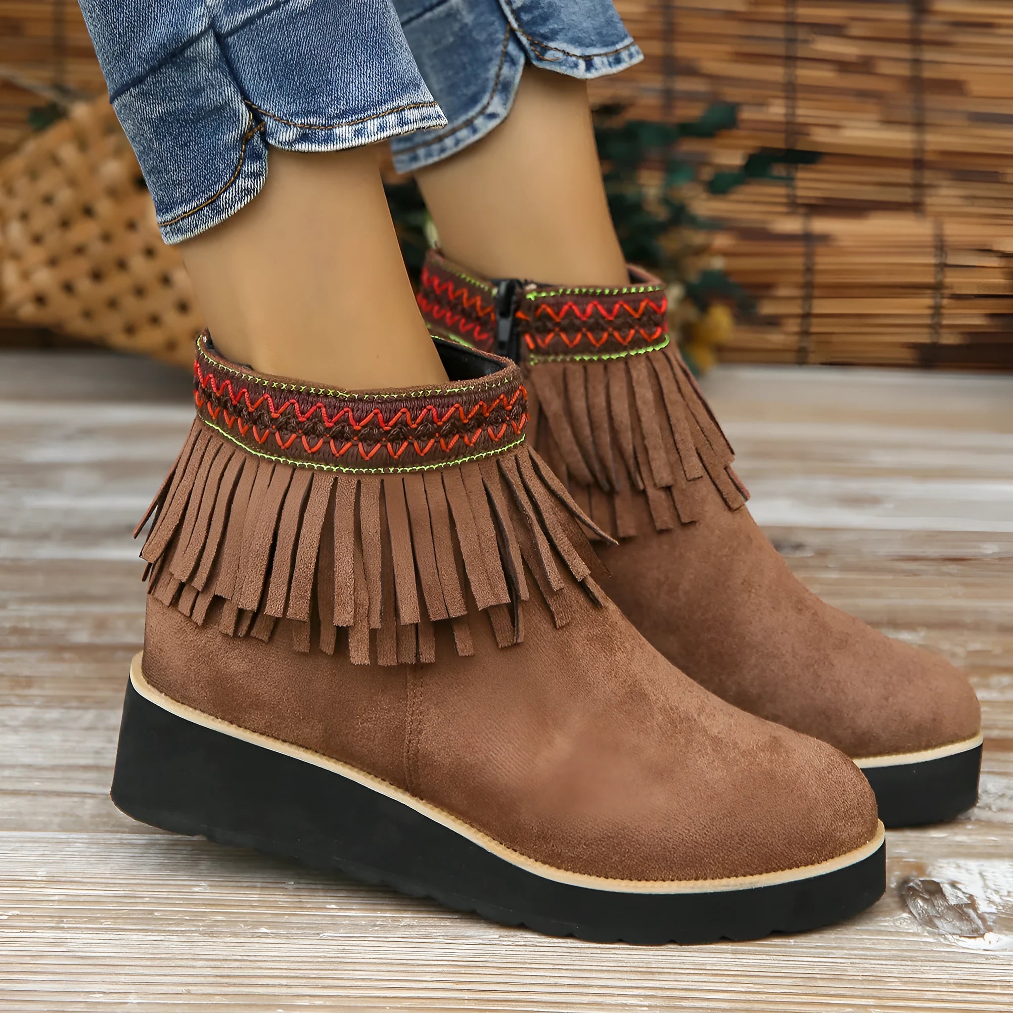 Women's dark brown suede wedge boots with a thick platform sole and side zipper.