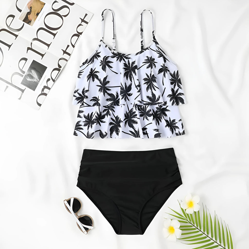 Black high waist swimsuit briefs with coconut tree print and sleeveless top on a mannequin