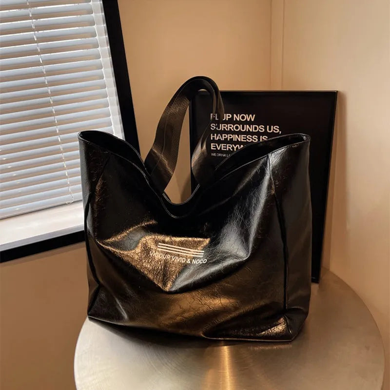 Large capacity PU tote bag for women in solid black, beige or brown, waterproof shoulder handbag for daily and travel use.