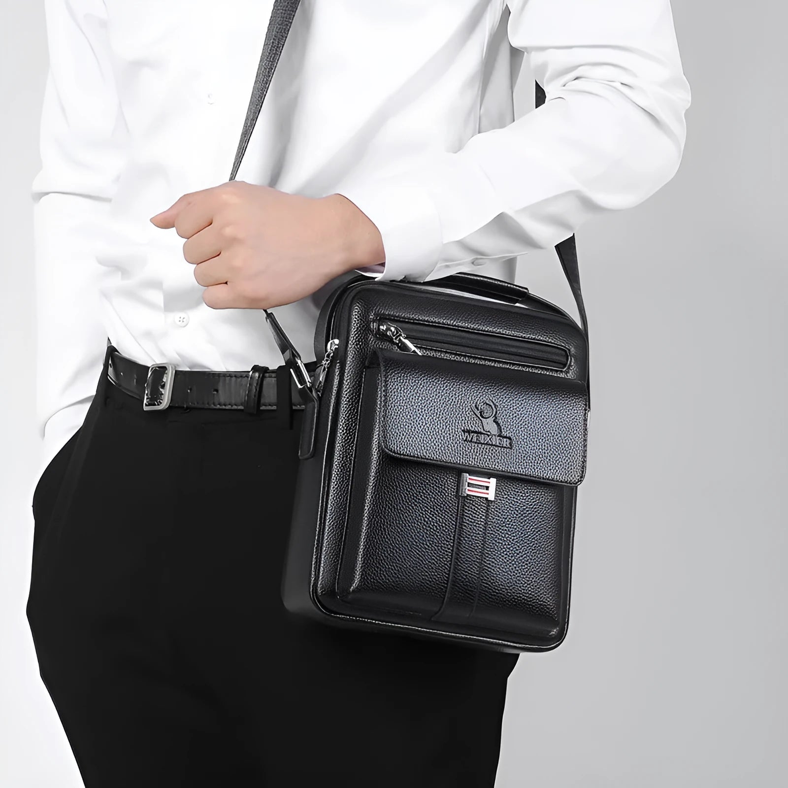 Men's PU leather crossbody shoulder bag in black plain finish with visible sewing line detail and crossbody strap