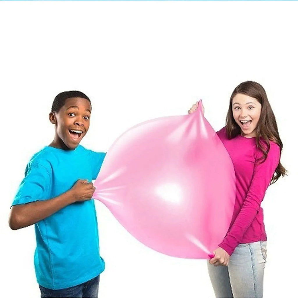 Large colourful inflatable bouncy ball in pink, yellow, green, and blue, shown in various sizes for children's play.