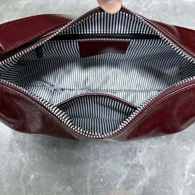 Women's cow leather crossbody bucket bag in Ankela Red with oil wax finish and shoulder straps