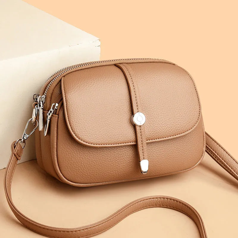 Women's soft PU leather crossbody shoulder bag oval shape in black khaki dark brown colours