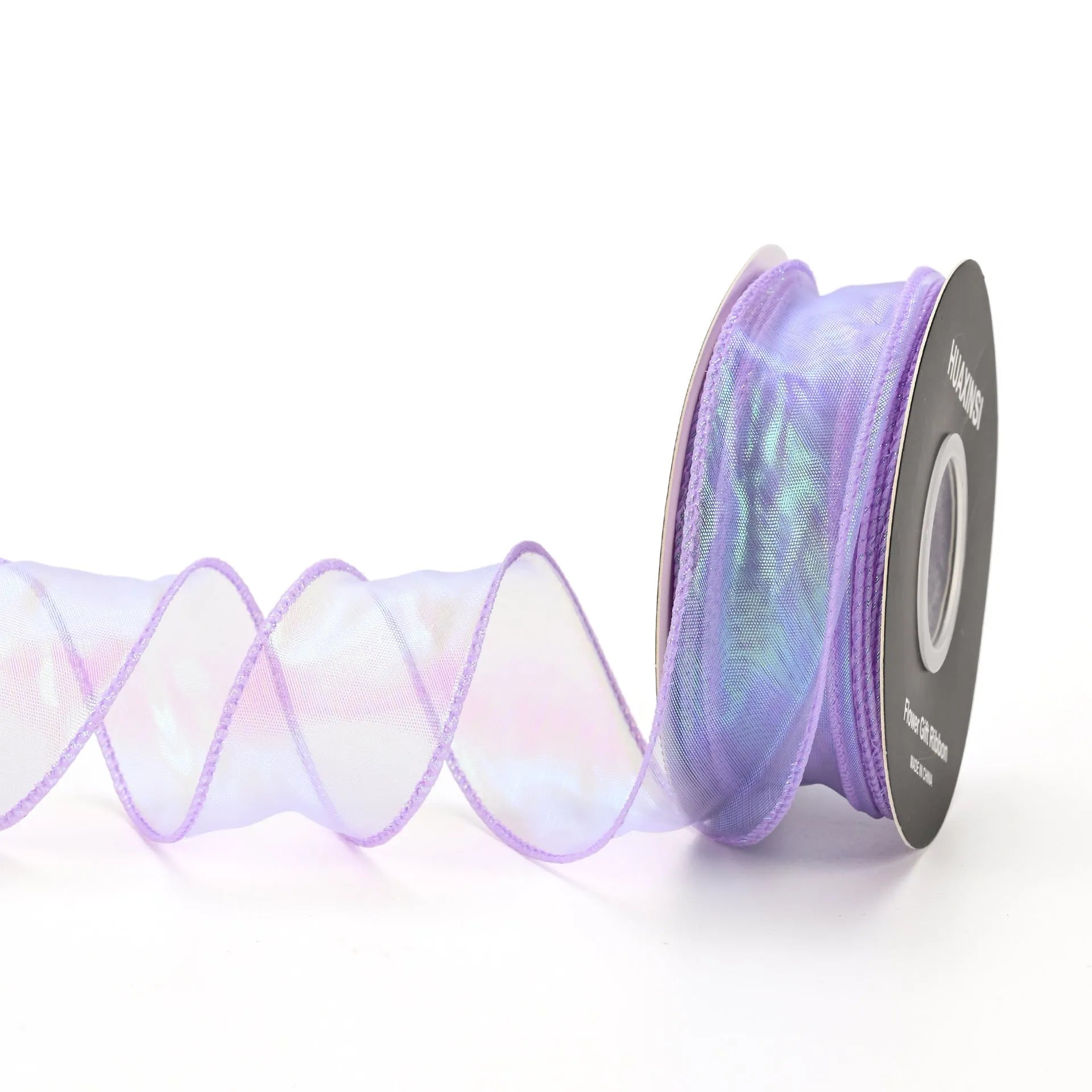 Roll of colourful wave patterned fishtail yarn decorative ribbon in mesh material, 4cm wide.