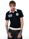 Black slim fit men's short sleeve polo shirt with an embroidered hat design on the front.