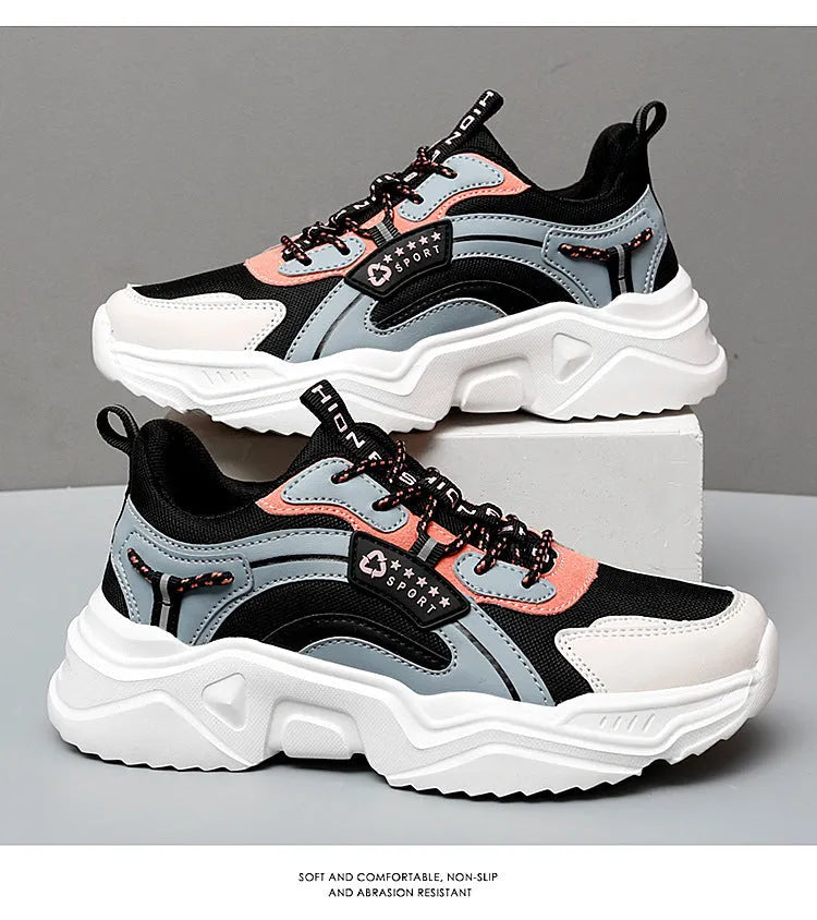 Women's white casual sports shoes with mesh upper, thick PU sole, and buckle detail