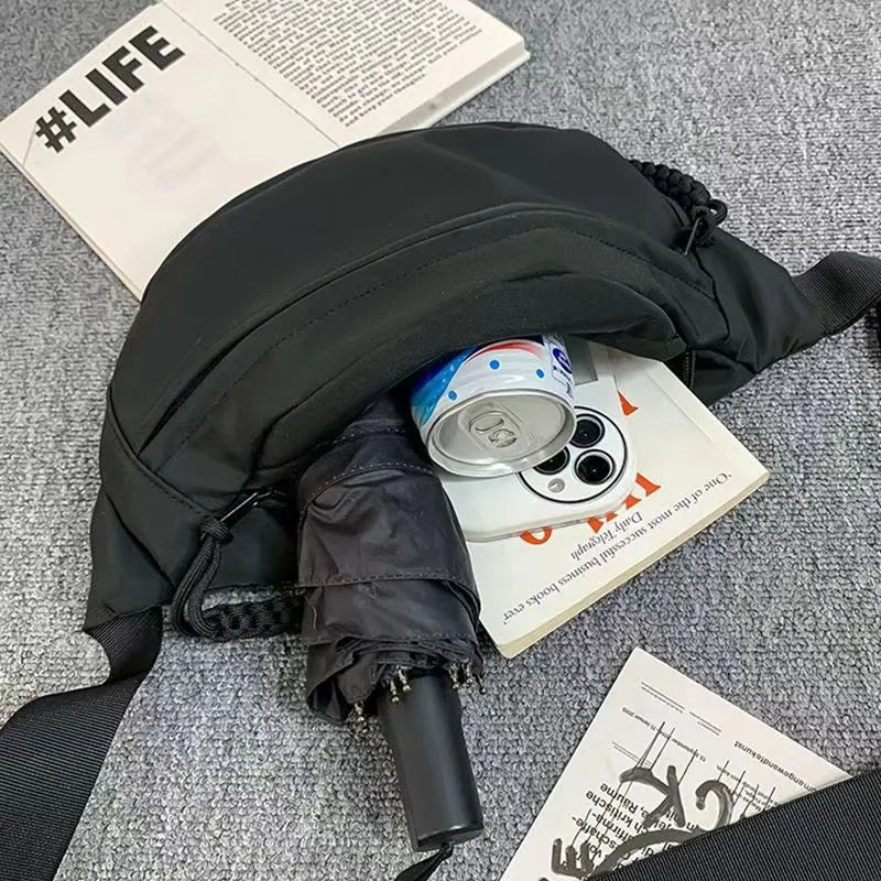 Men's black polyester chest bag shown as a crossbody bag with 35cm width