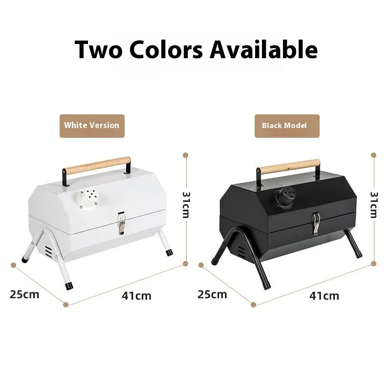 White portable charcoal barbecue grill with chimney oven, folded legs, two grill meshes, and detachable fuel tanks on a wooden table.