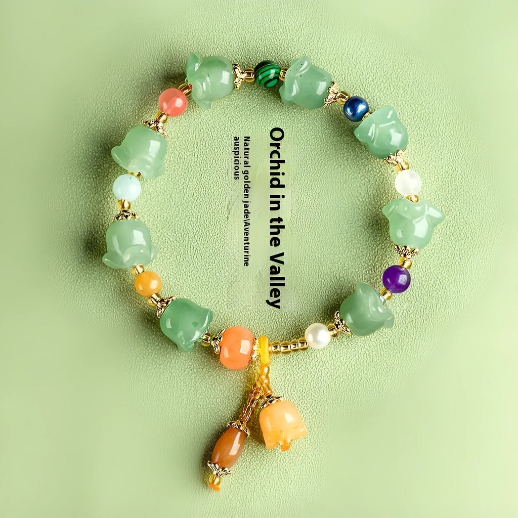 Women's natural jade orchid bracelet with carved beads for 14-18cm wrist.
