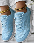 Women's white canvas casual running shoes with flat sole on a light background.