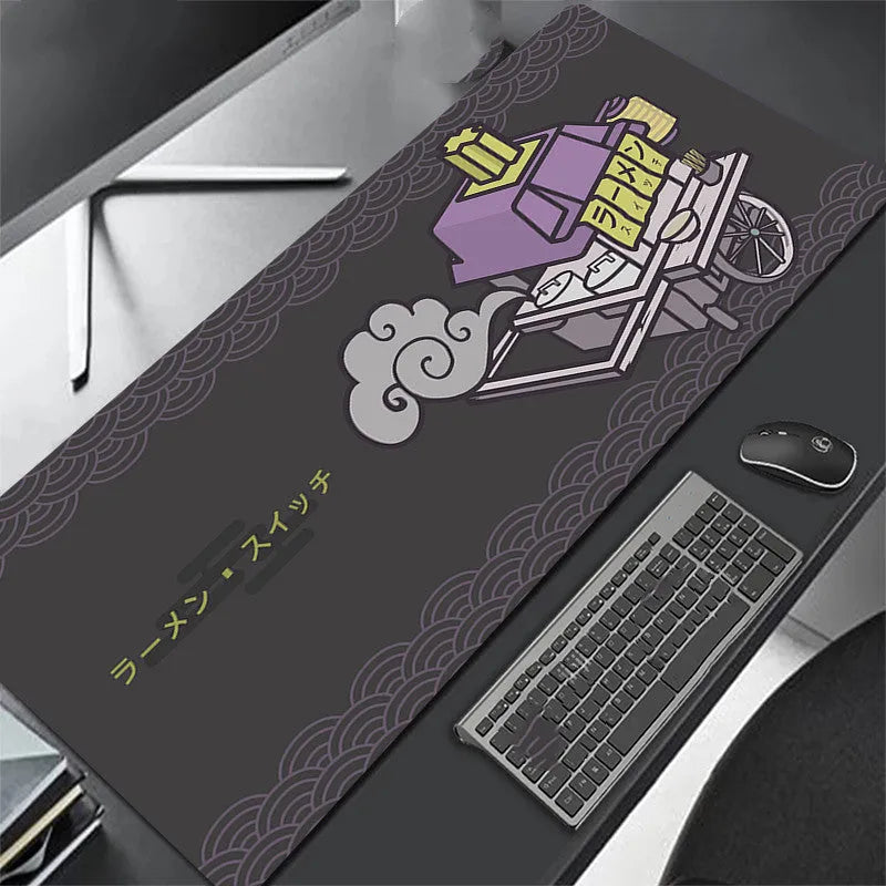 All black extra long mouse pad with precision overlock stitching on a desk
