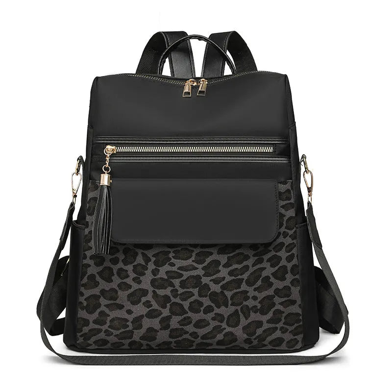 Leopard print women's large capacity nylon backpack in black, brown or beige with stitching and splicing.