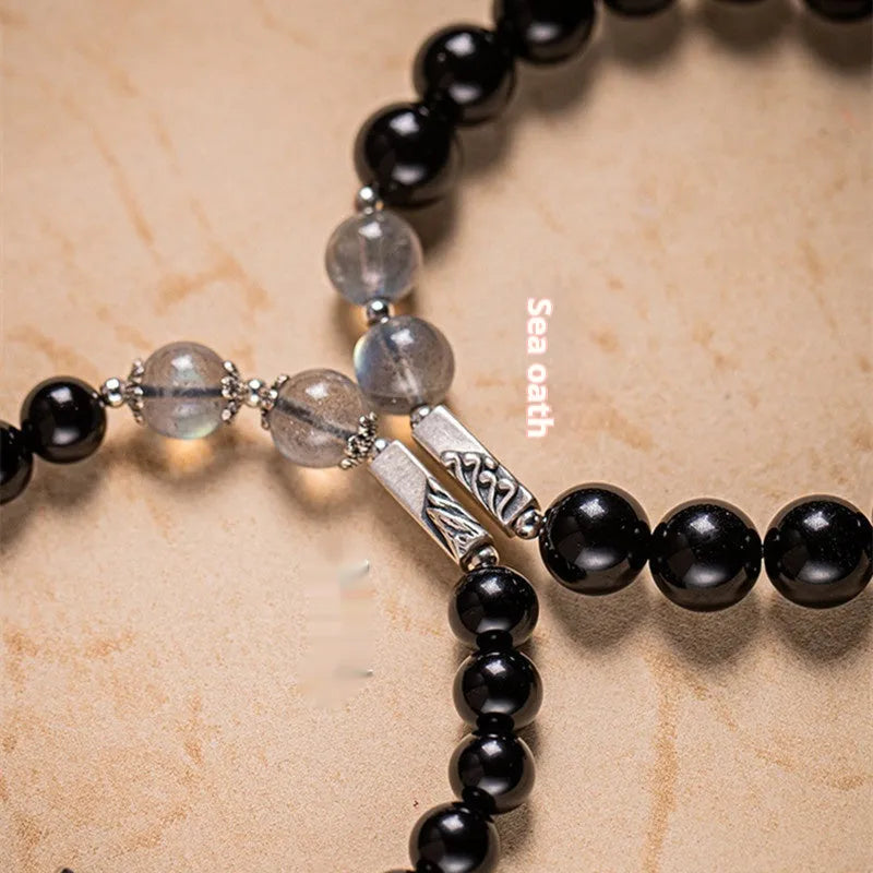 Obsidian Buddha beads couple bracelet DIY kit showing 8mm and 10mm beads with elastic cord