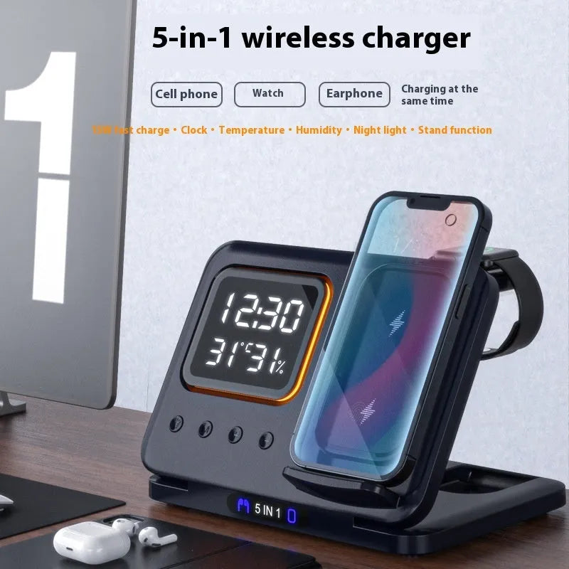 Black 5-in-1 wireless charging station displaying time and temperature, charging a phone and a smartwatch.