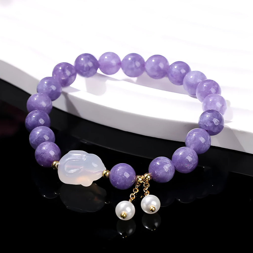 Purple aquamarine chalcedony and agate rabbit bracelet with geometric beads sized 6mm, 8mm, and 12 by 16mm.