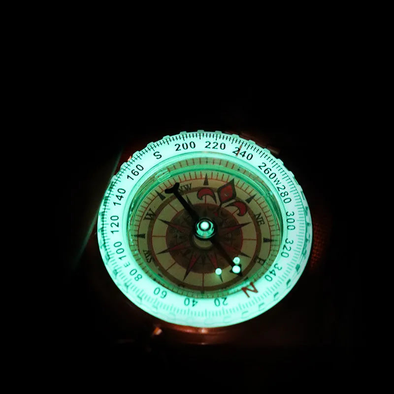 Gold brass flip compass with luminous dial and lid closed, 50mm diameter for outdoor navigation