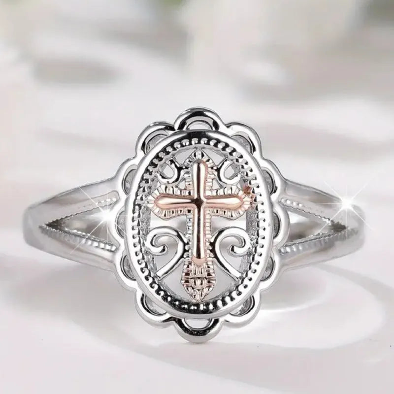 Silver-coloured personalised cross lace ring showing intricate patterning and cross design on alloy band