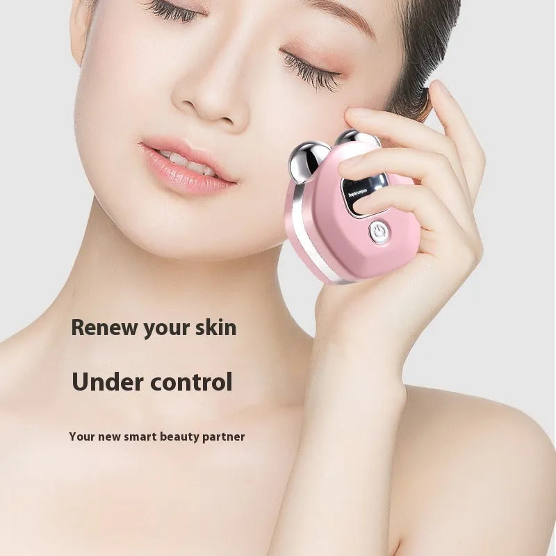 Portable light blue micro current double-roller facial massage instrument with hot compress function.