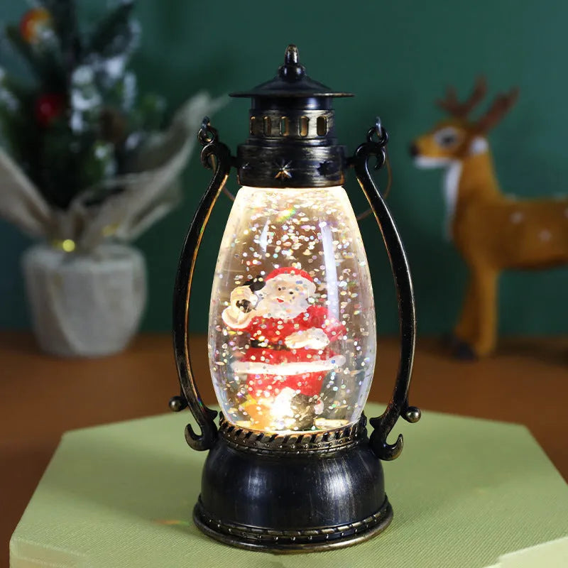 Plastic oil lamp snow globe ornament lit up with snowman figurine on a desktop.
