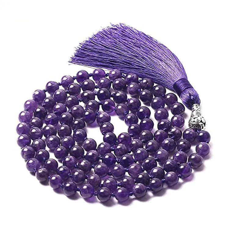 Long geometric agate tassel necklace with multi-coloured stones on a white background.
