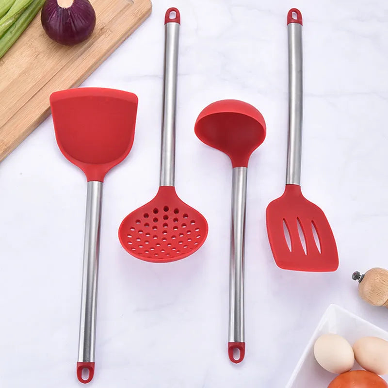 8-piece silicone kitchenware set with stainless steel tube handles in black and red, including spatulas and colander