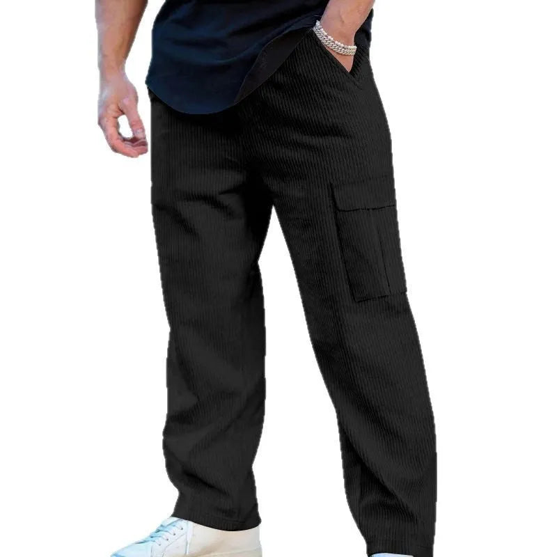 Men's navy blue corduroy cargo trousers with a drawstring waist and straight wide-leg cut on a hanger.