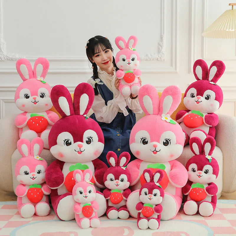 Pink strawberry rabbit plush toy doll pillow with soft furry fabric on white background
