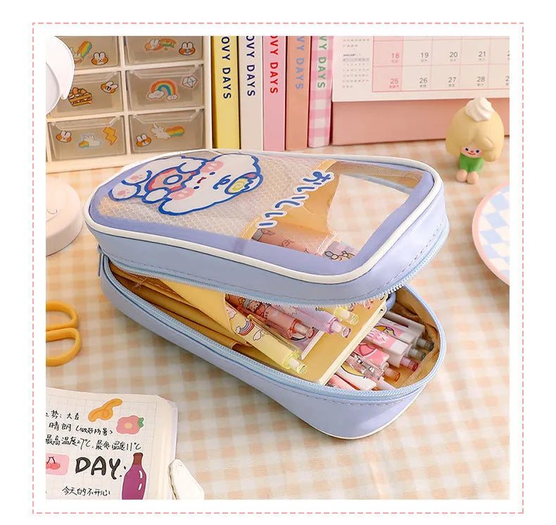 Transparent PVC student pencil case with Korean-style cartoon design showing stationery storage capacity