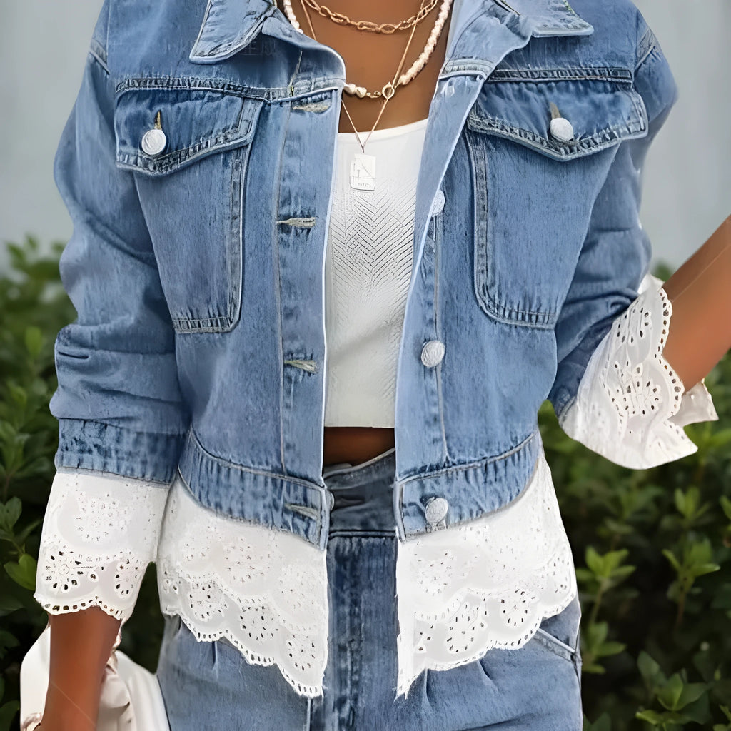 Blue women's denim jacket with lace stitching detail on the front, showing long sleeves.