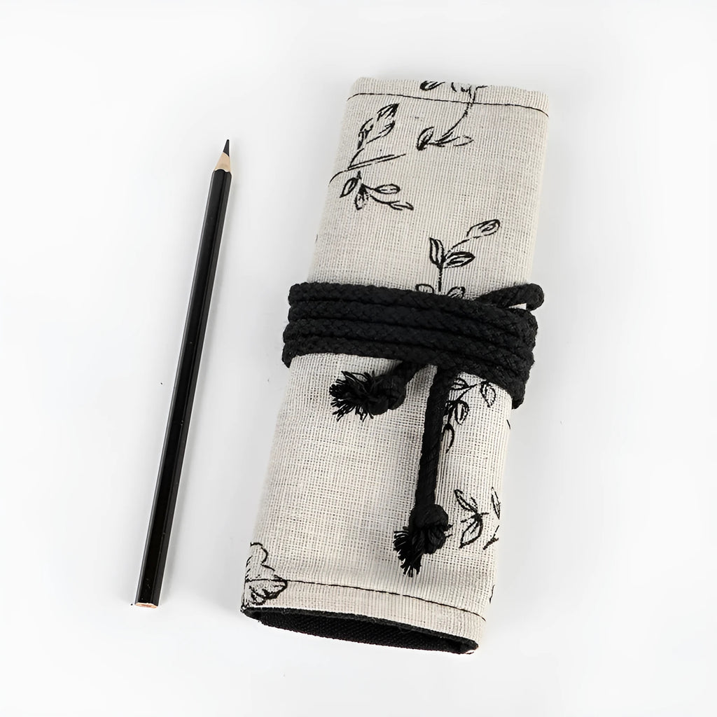 Black peony floral print canvas pencil roll bag unrolled to show 24 pencil sleeves