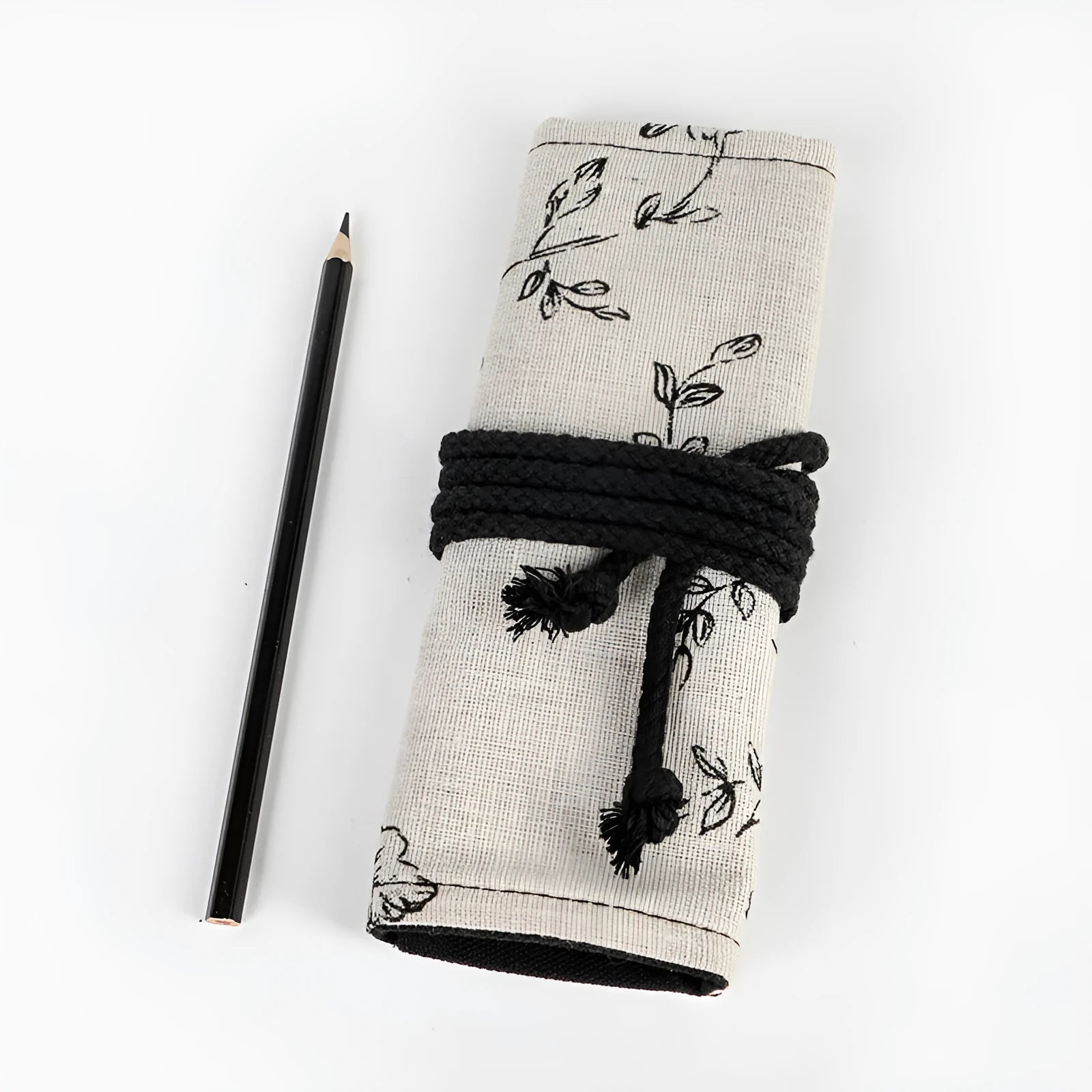 Black peony floral print canvas pencil roll bag unrolled to show 24 pencil sleeves