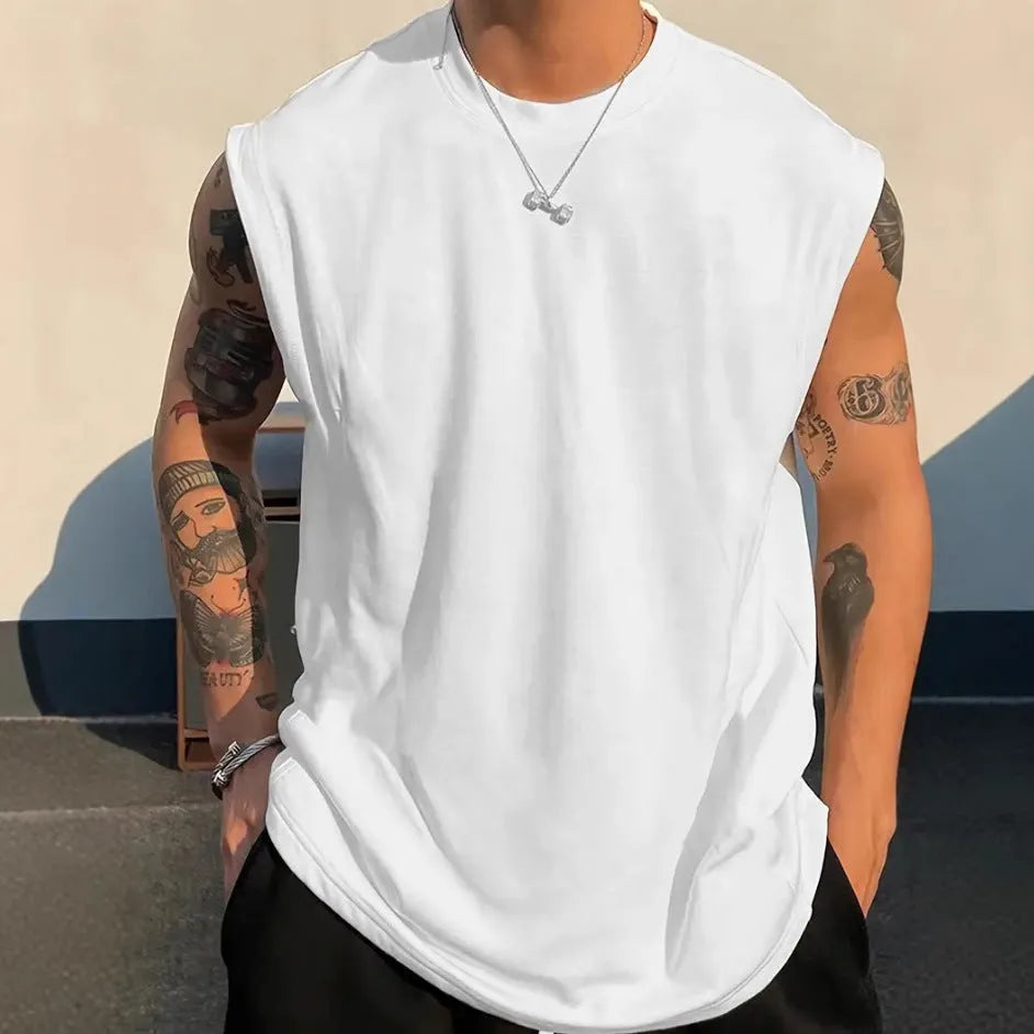 Men's loose fit cotton tank top in solid colours showing sleeveless design and straight hem