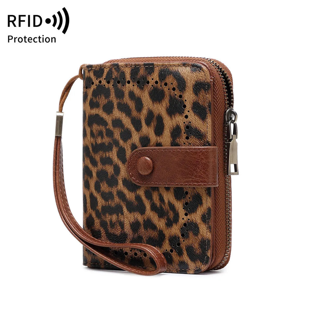 Small retro wallet with zipper closure in leopard print pattern showing hollow detailing and contrast stitching