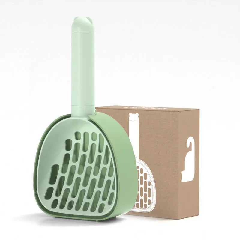 White ABS plastic cat litter scoop with a stand-up base and hidden bag storage compartment.