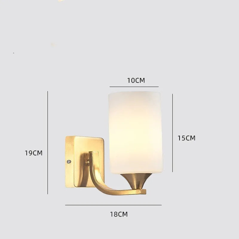 Modern copper coloured wall lamp with glass lampshade for bedroom or hallway lighting